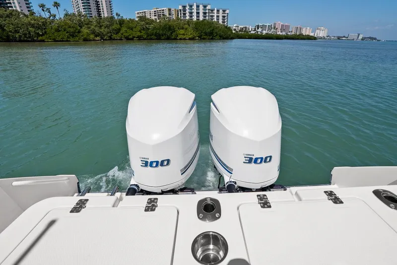 Slide: The Image of Edgewater 280CX Crossover 2018 with Yamaha 300 engines on calm water. - 17