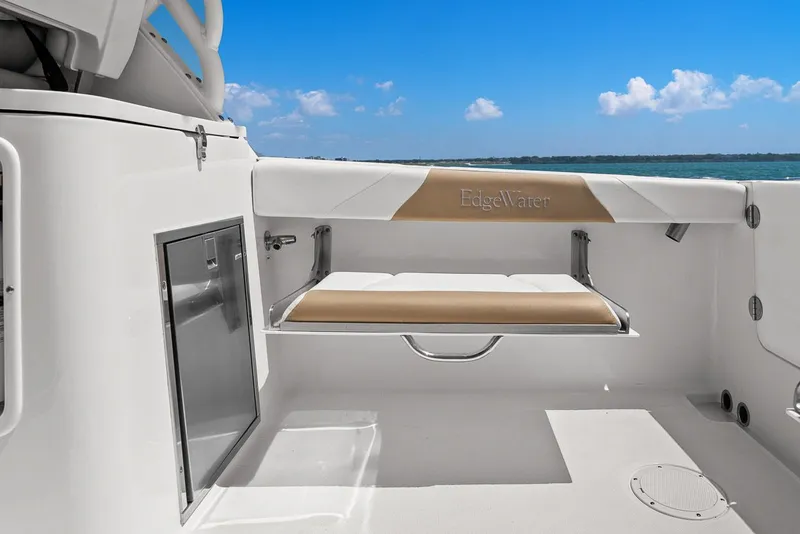 Slide: The Image of Interior of 2018 Edgewater 280CX Crossover with bench seat and ocean view. - 22