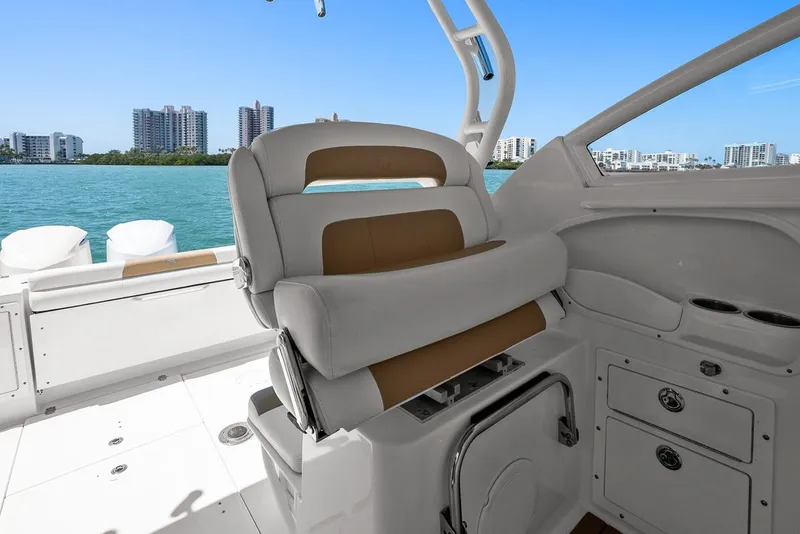 Slide: The Image of Interior of Edgewater 280CX Crossover boat, overlooking the water. - 26