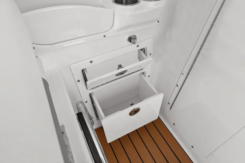 Slide: The Image of Interior of 2018 Edgewater 280CX Crossover with storage compartments. - 28