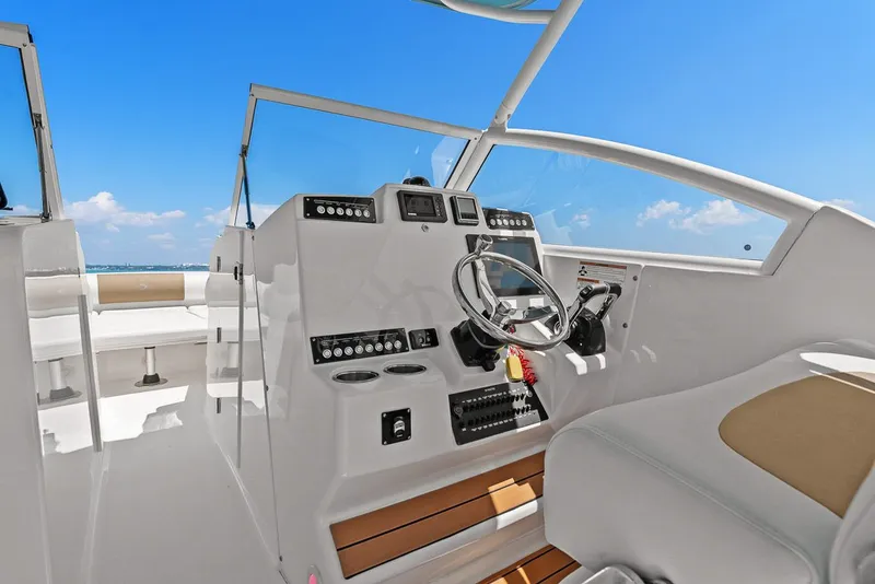 Slide: The Image of Interior view of 2018 Edgewater 280CX Crossover boat cockpit. - 32