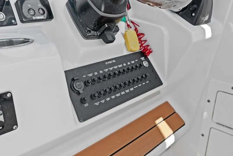 Slide: The Image of Dashboard of 2018 Edgewater 280CX Crossover with control panel. - 34