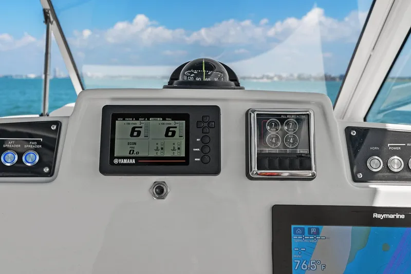 Slide: The Image of Dashboard of 2018 Edgewater 280CX Crossover with Yamaha displays. - 36