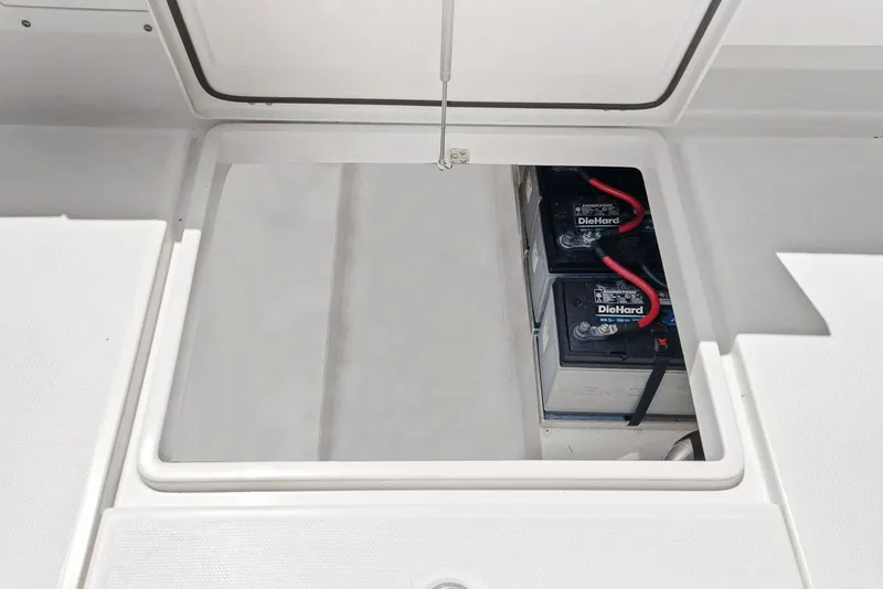 Slide: The Image of Battery compartment of 2018 Edgewater 280CX Crossover with DieHard batteries. - 44