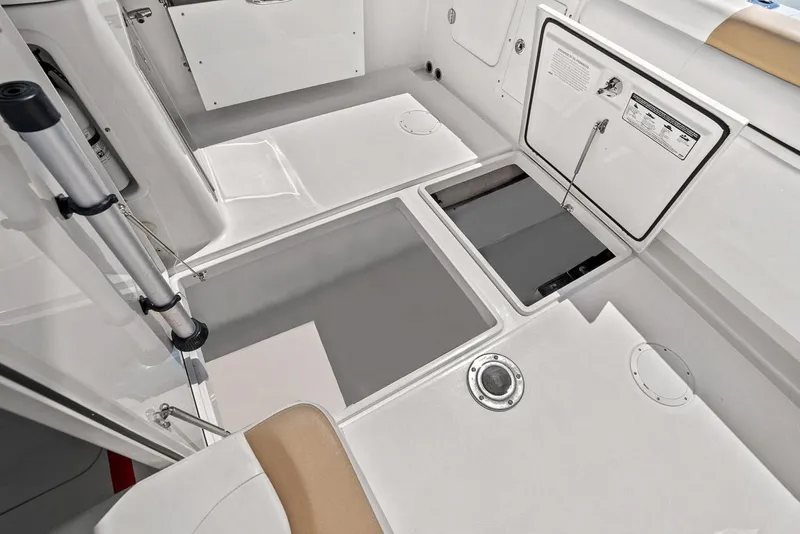 Slide: The Image of Interior of 2018 Edgewater 280CX Crossover with storage compartments. - 46