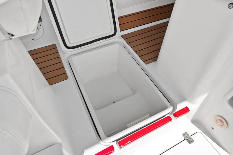 Slide: The Image of Open storage compartment in 2018 Edgewater 280CX Crossover boat. - 47