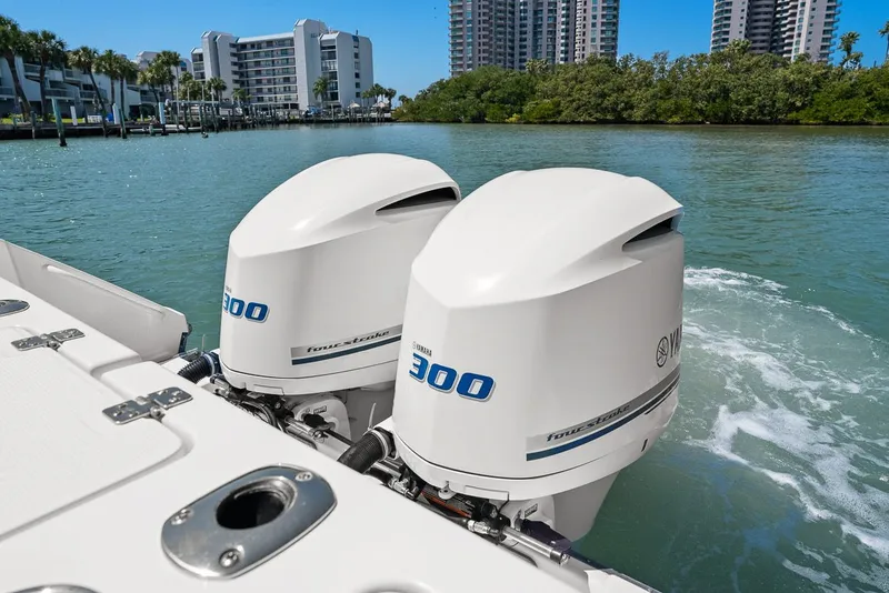 Slide: The Image of 2018 Edgewater 280CX Crossover with Yamaha 300 engines on water. - 7