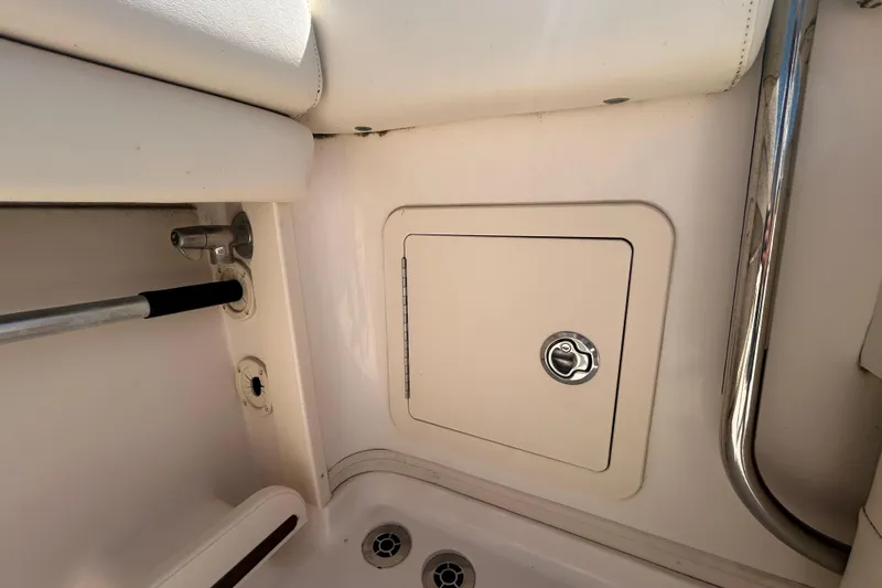 Slide: The Image of Interior view of a 2021 Grady-White Gulfstream 232 boat, featuring a storage compartment. - 17