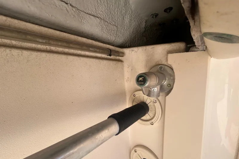 Slide: The Image of 2021 Grady-White Gulfstream 232 boat interior detail with hose and fittings. - 21