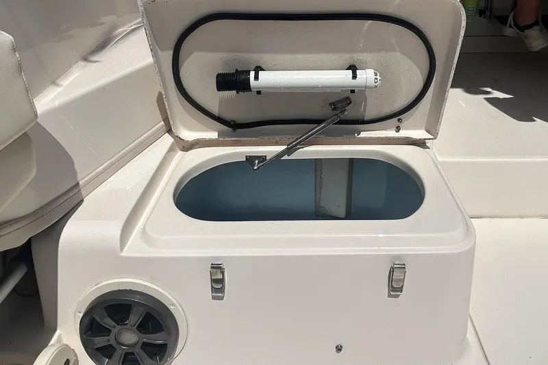 Slide: The Image of Open storage compartment on 2021 Grady-White Gulfstream 232 boat deck. - 23