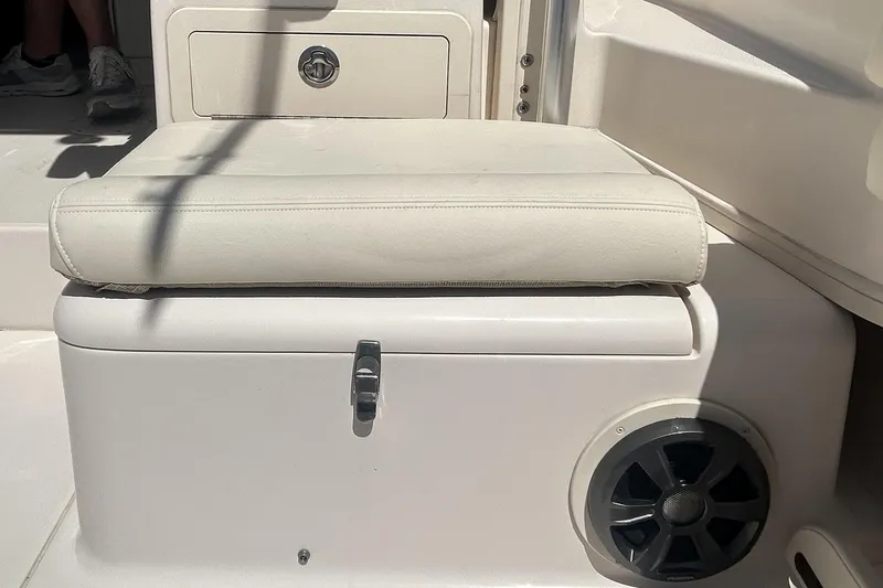 Slide: The Image of Cushioned seat on 2021 Grady-White Gulfstream 232 boat with storage and speaker. - 24