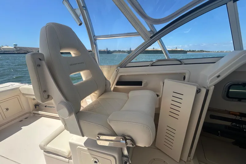 Slide: The Image of 2021 Grady-White Gulfstream 232 boat interior with comfortable seating and ocean view. - 26