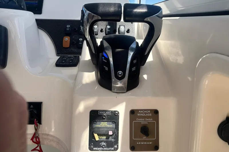 Slide: The Image of Control panel of a 2021 Grady-White Gulfstream 232 boat with throttle and switches. - 35
