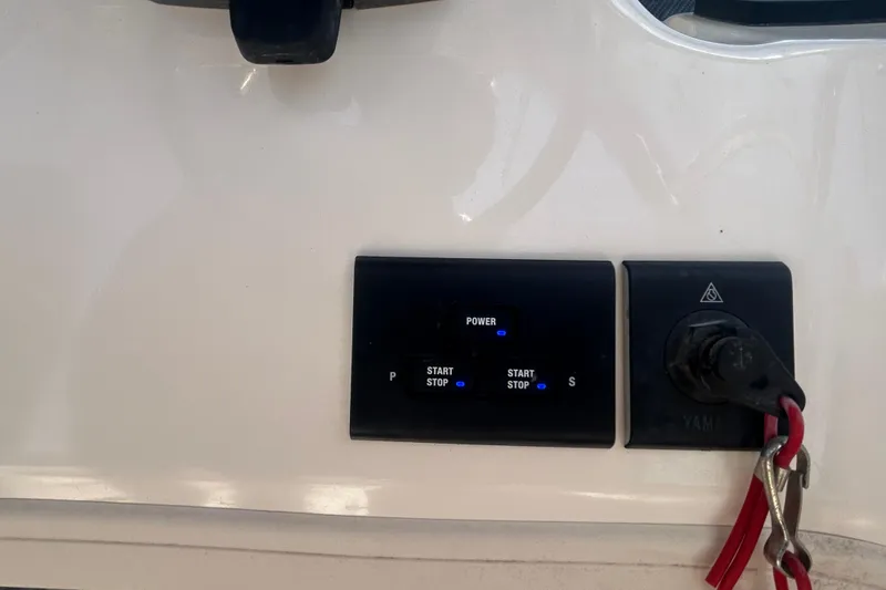 Slide: The Image of Control panel of a 2021 Grady-White Gulfstream 232 boat with start/stop buttons. - 36
