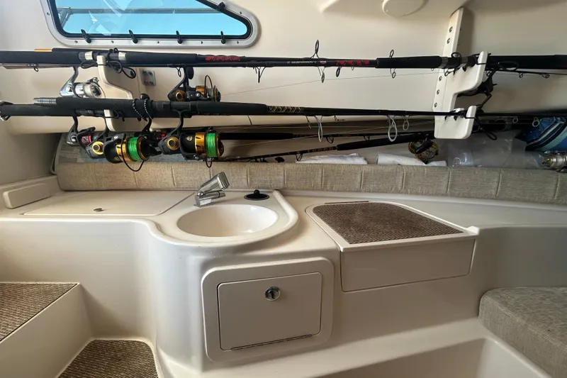 Slide: The Image of Interior of 2021 Grady-White Gulfstream 232 boat with fishing rods and sink. - 42