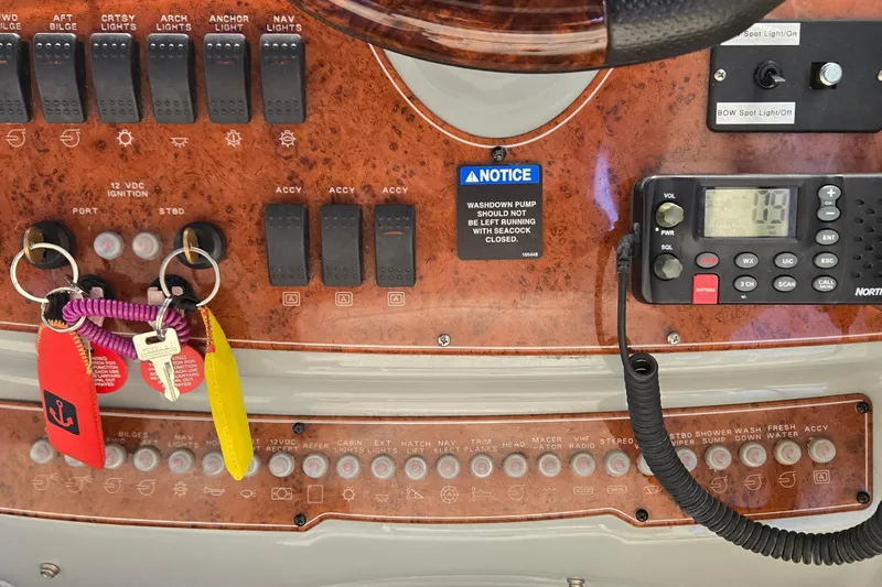 Slide: The Image of Control panel of a 2007 Bayliner 325 boat with switches and keys. - 17
