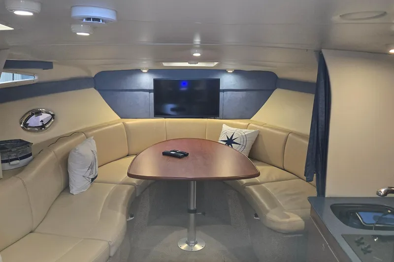 Slide: The Image of Interior of 2007 Bayliner 325 yacht with cozy seating and modern amenities. - 19