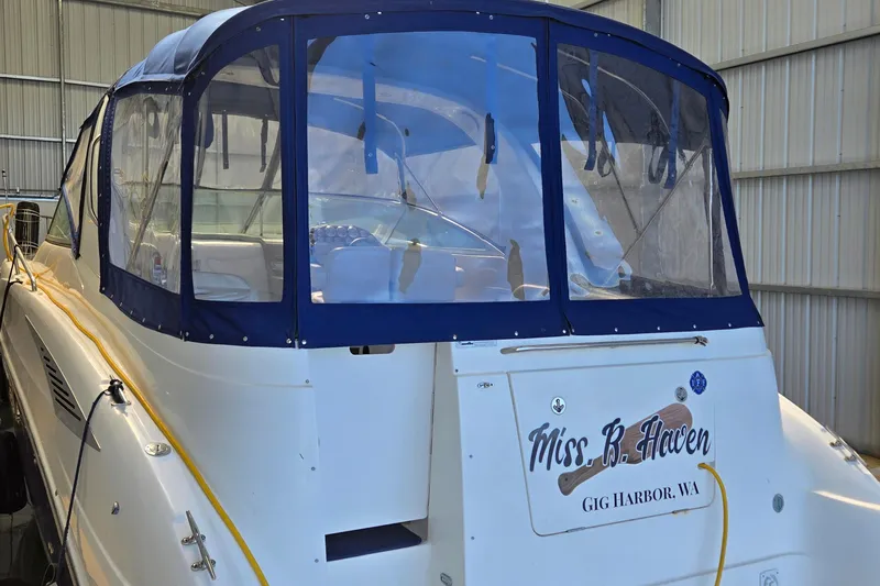 Slide: The Image of 2007 Bayliner 325 boat with blue canopy, docked in Gig Harbor, WA. - 4