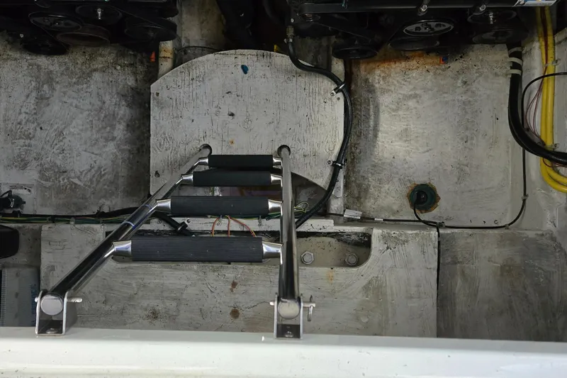 Slide: The Image of Engine compartment of a 2007 Bayliner 325 boat with visible ladder and wiring. - 41