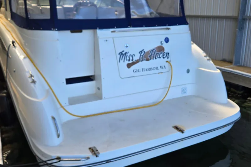 Slide: The Image of 2007 Bayliner 325 boat docked, featuring "Miss B. Haven" nameplate, Gig Harbor, WA. - 5