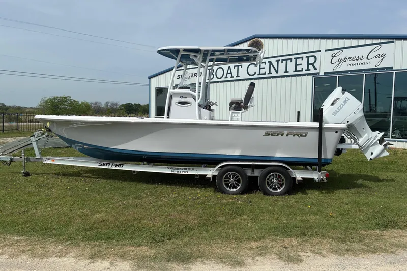 The Image of 2026 Sea Pro 250 Bay boat on trailer outside Cypress Cay Boat Center. - 1