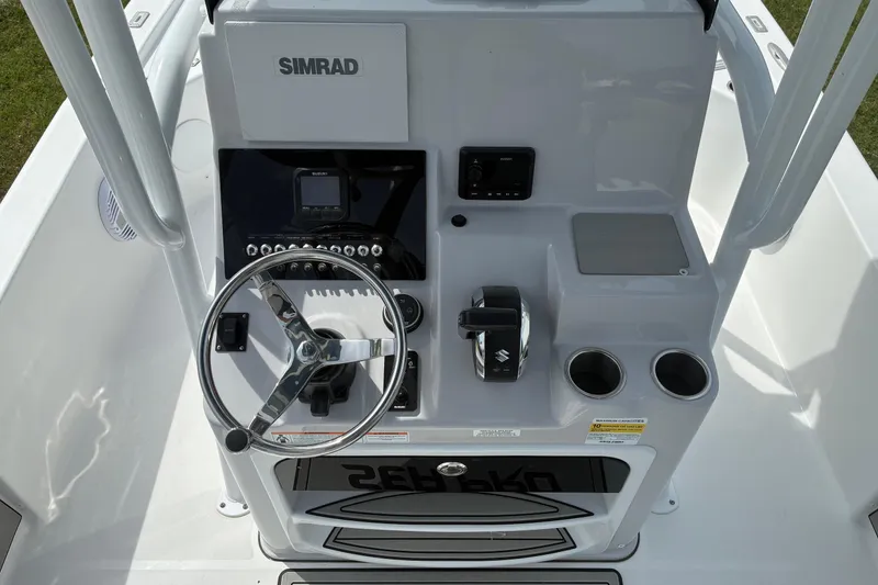 Slide: The Image of 2026 Sea Pro 250 Bay boat console with steering wheel and Simrad electronics. - 10