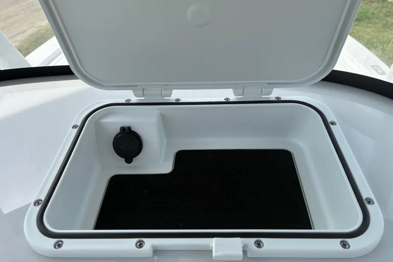 Slide: The Image of Open storage compartment on 2026 Sea Pro 250 Bay boat. - 11