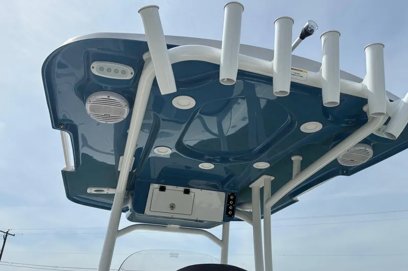Slide: The Image of 2026 Sea Pro 250 Bay boat's T-top with rod holders and speakers. - 12