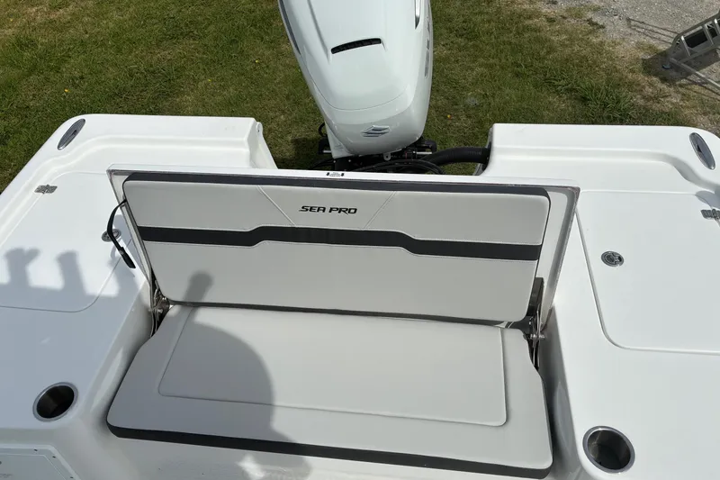 Slide: The Image of 2026 Sea Pro 250 Bay boat with foldable seat and outboard motor. - 14
