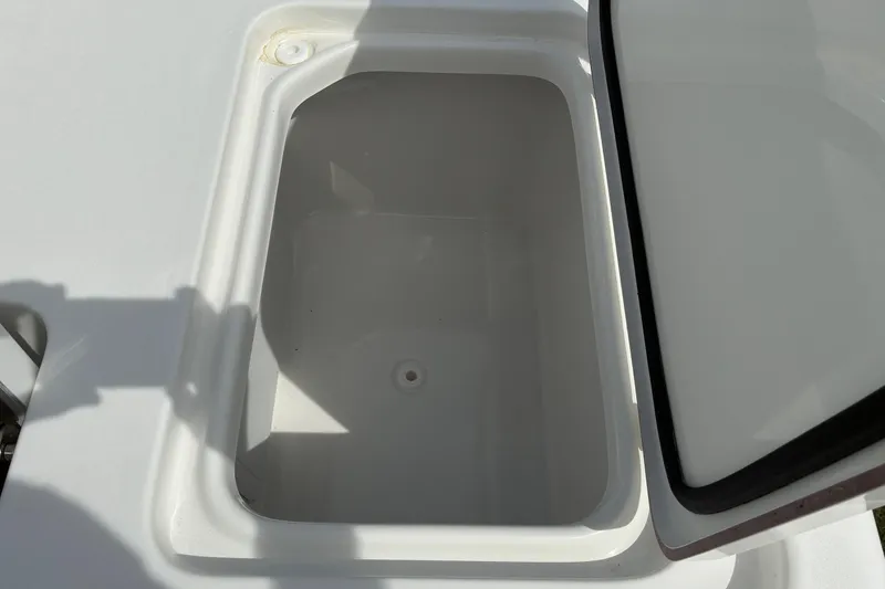 Slide: The Image of Open storage compartment on 2026 Sea Pro 250 Bay boat, showcasing interior space. - 16