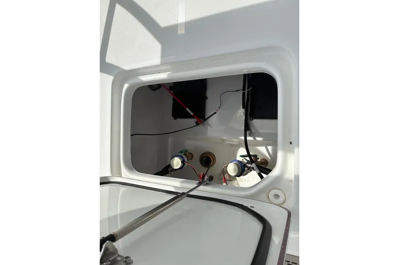 Slide: The Image of 2026 Sea Pro 250 Bay boat compartment with wiring and components. - 17