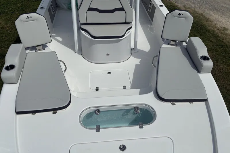 Slide: The Image of 2026 Sea Pro 250 Bay boat interior with seating and storage compartments. - 5
