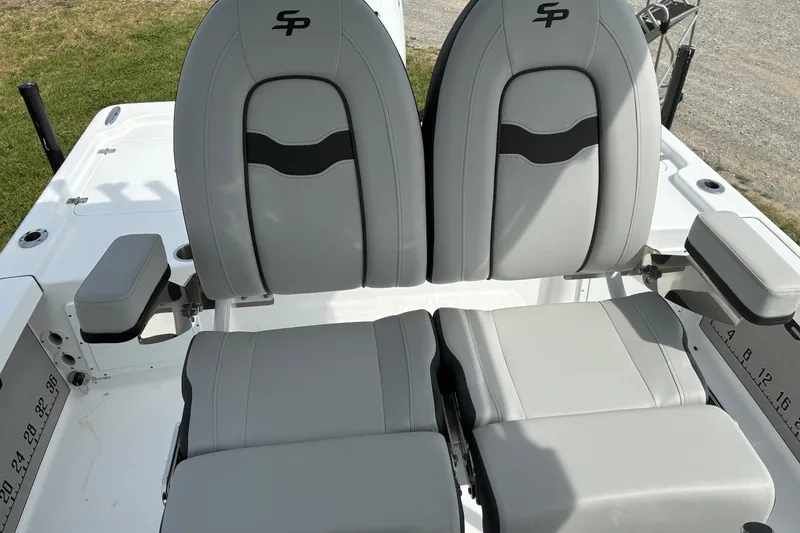 Slide: The Image of 2026 Sea Pro 250 Bay boat seats with gray upholstery and armrests. - 8