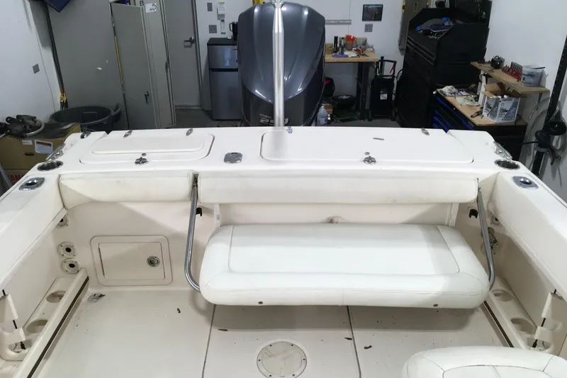 Slide: The Image of 2016 Grady-White Freedom 225 boat interior with seating and storage compartments. - 12