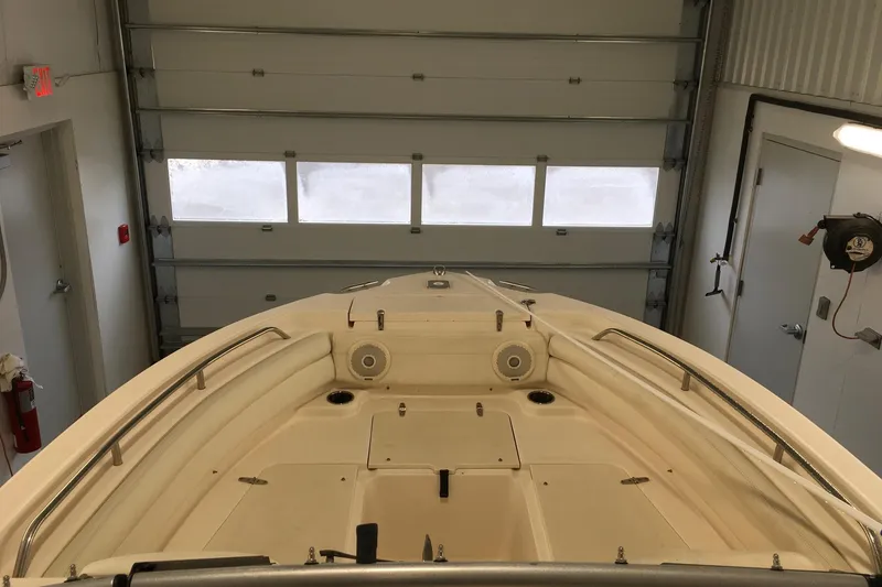 Slide: The Image of 2016 Grady-White Freedom 225 boat interior in a garage setting. - 9
