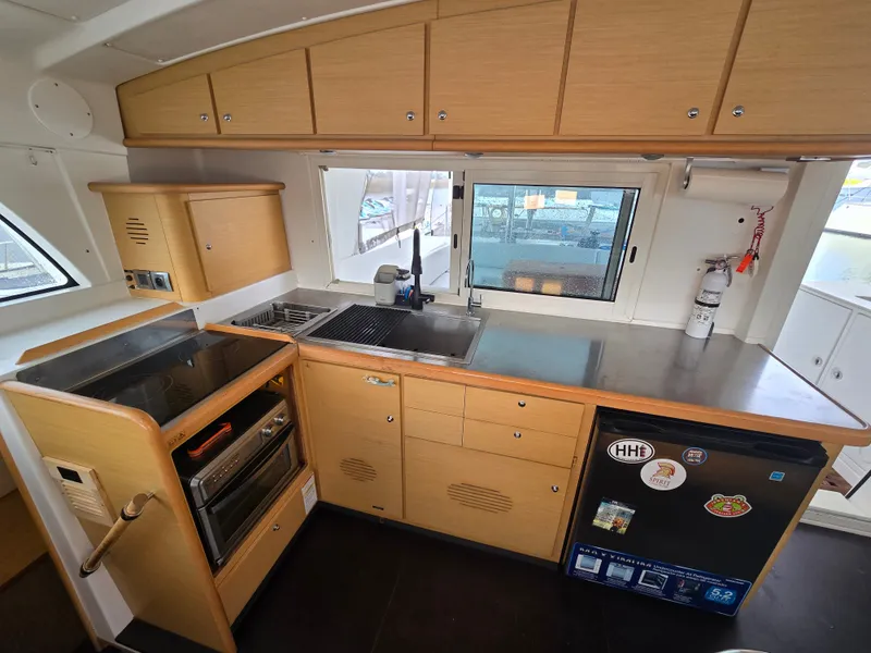 Slide: The Image of Interior of Lagoon 440 yacht kitchen, 2007 model, featuring modern amenities. - 13