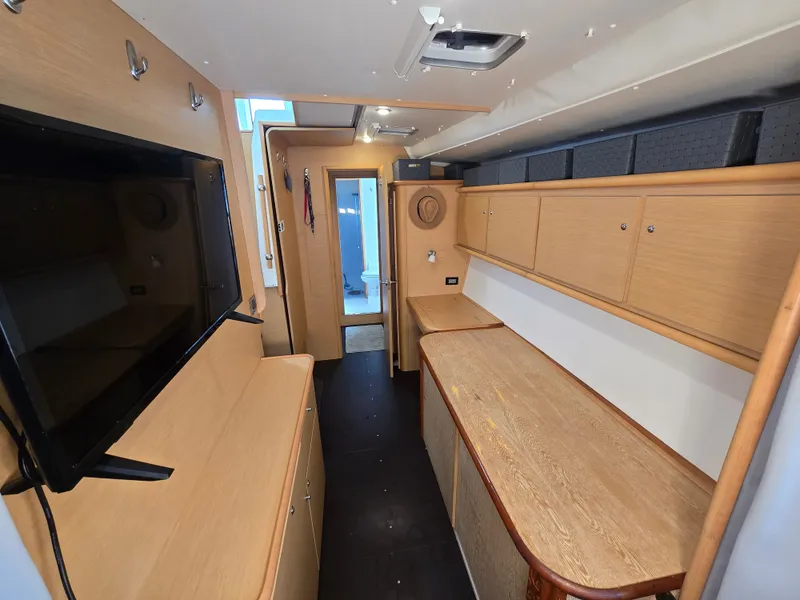 Slide: The Image of Interior of a 2007 Lagoon 440 yacht with wooden cabinetry. - 17