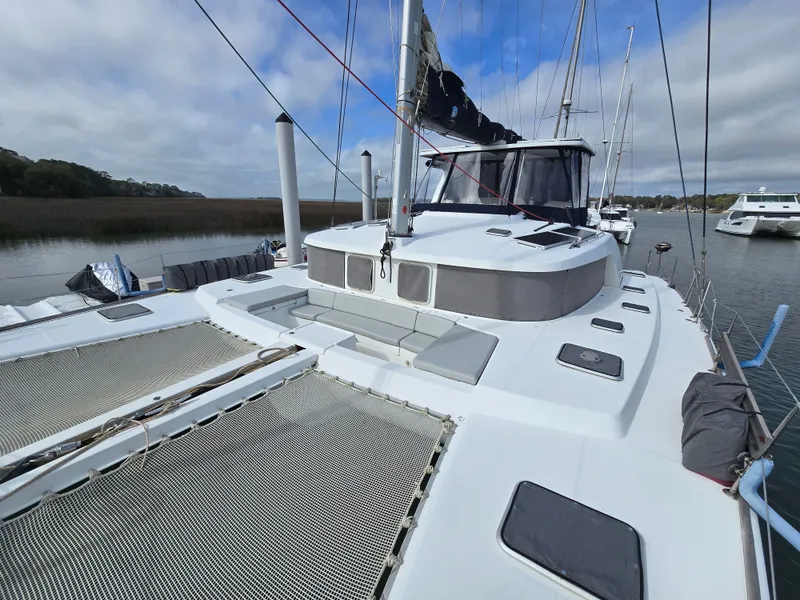 Slide: The Image of 2007 Lagoon 440 catamaran docked, front deck view. - 2