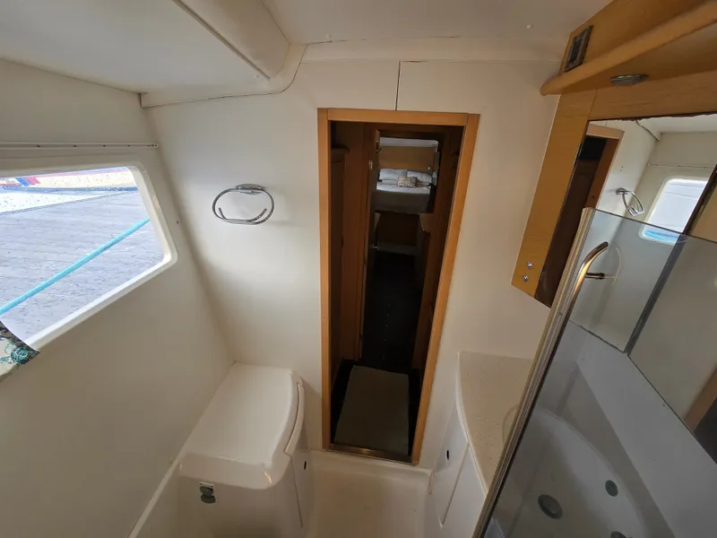 Slide: The Image of Interior of a 2007 Lagoon 440 yacht featuring bathroom and cabin. - 20