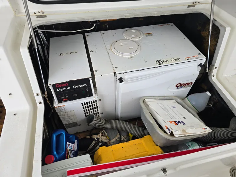 Slide: The Image of Lagoon 440 2007 boat generator compartment with Onan Marine Genset. - 28