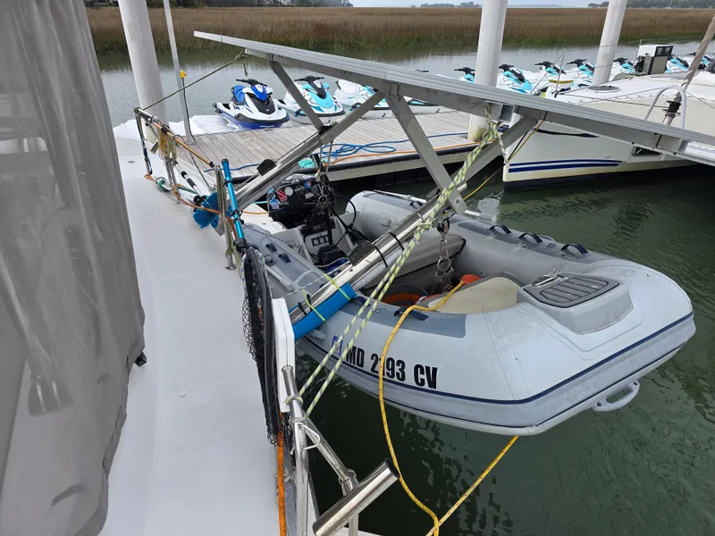 Slide: The Image of Lagoon 440 catamaran with dinghy at dock, year 2007. - 29