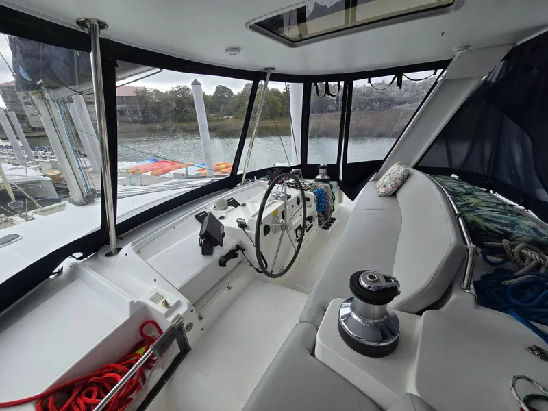 Slide: The Image of Interior of a 2007 Lagoon 440 yacht with steering wheel and seating area. - 6