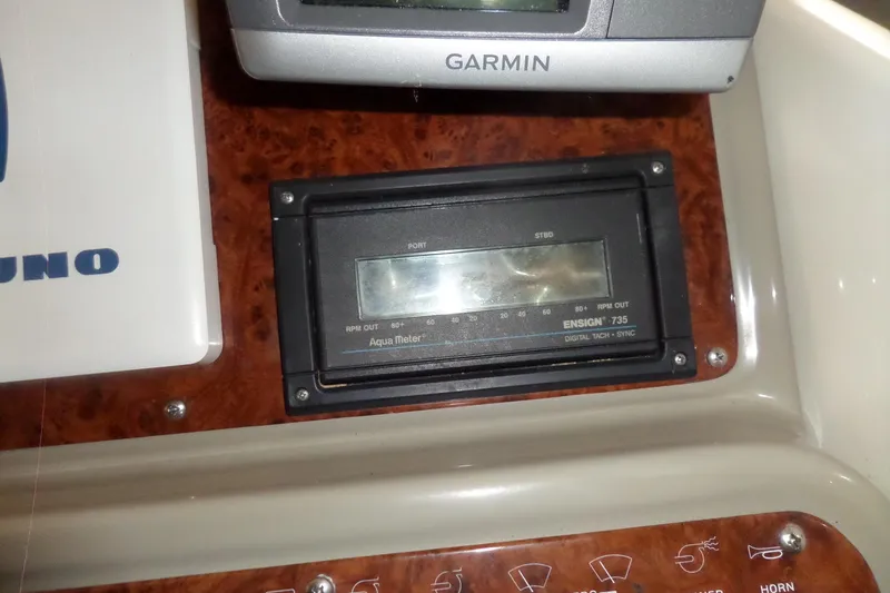 Slide: The Image of Control panel of a 2000 Bayliner 3055 Ciera with Garmin and Aqua Meter devices. - 11