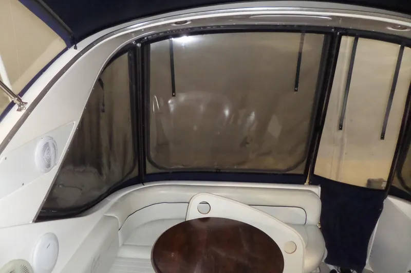 Slide: The Image of Interior of a 2000 Bayliner 3055 Ciera boat with seating and table. - 15