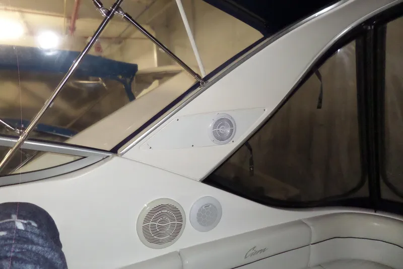 Slide: The Image of Interior view of a 2000 Bayliner 3055 Ciera boat with speakers and seating. - 24