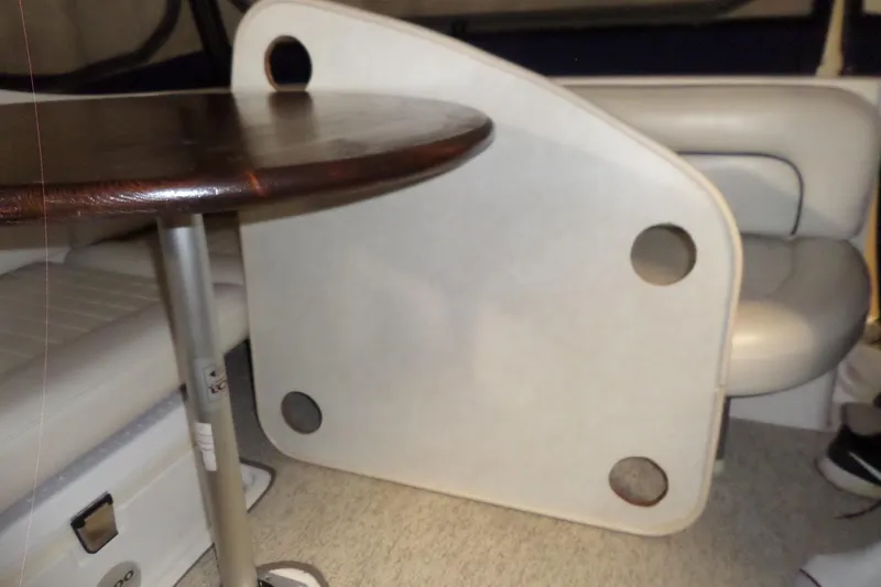 Slide: The Image of Interior of a 2000 Bayliner 3055 Ciera boat with seating and table. - 28