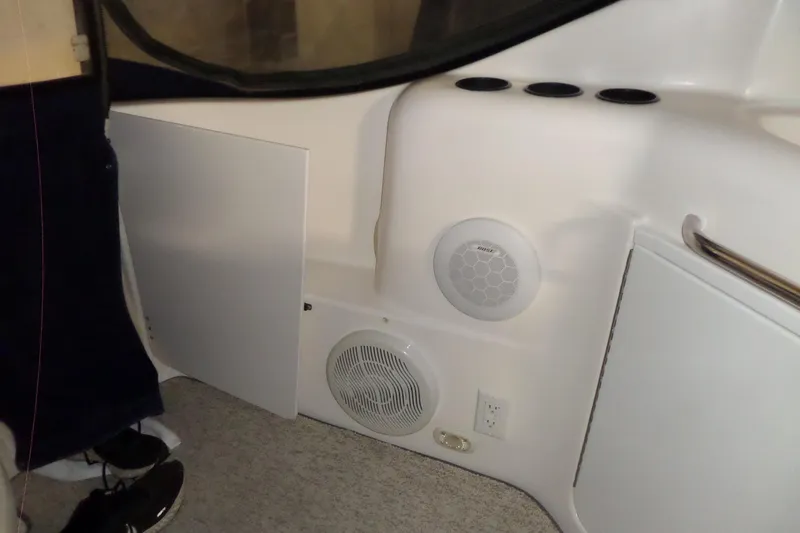 Slide: The Image of Interior of 2000 Bayliner 3055 Ciera boat with speakers and storage compartments. - 29