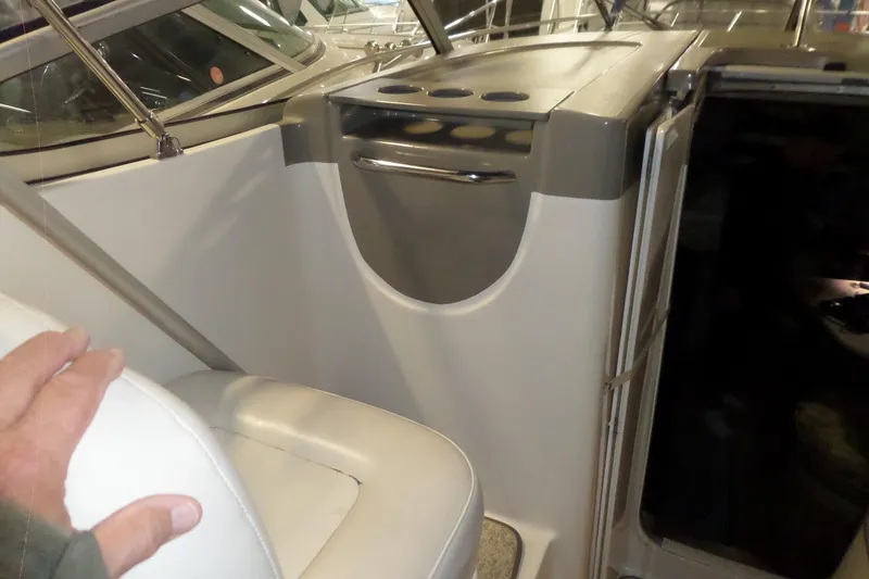 Slide: The Image of Interior view of a 2000 Bayliner 3055 Ciera boat with seating and storage. - 31