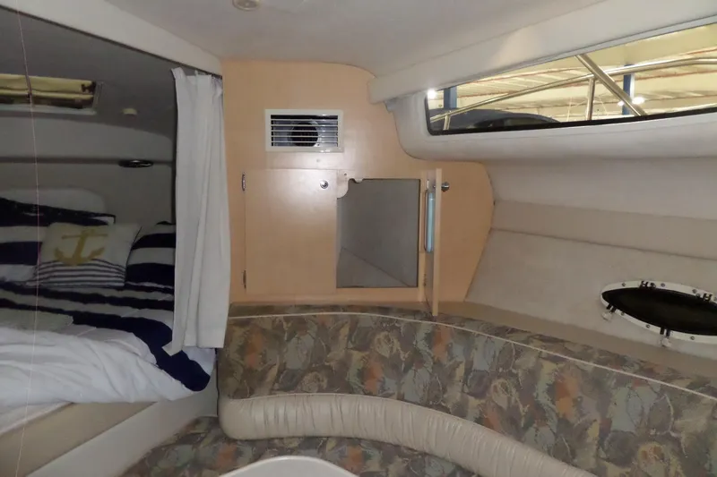 Slide: The Image of Interior of 2000 Bayliner 3055 Ciera boat with cozy cabin and nautical decor. - 33