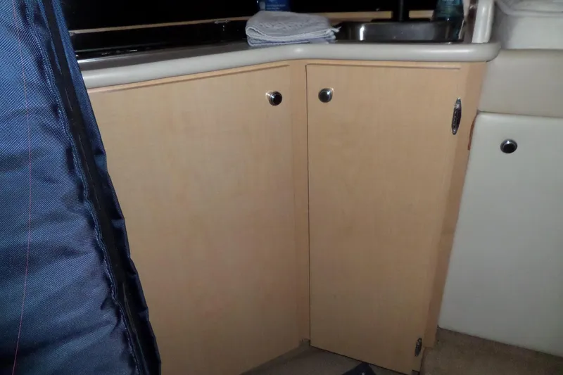 Slide: The Image of Interior view of 2000 Bayliner 3055 Ciera boat kitchen cabinetry. - 36